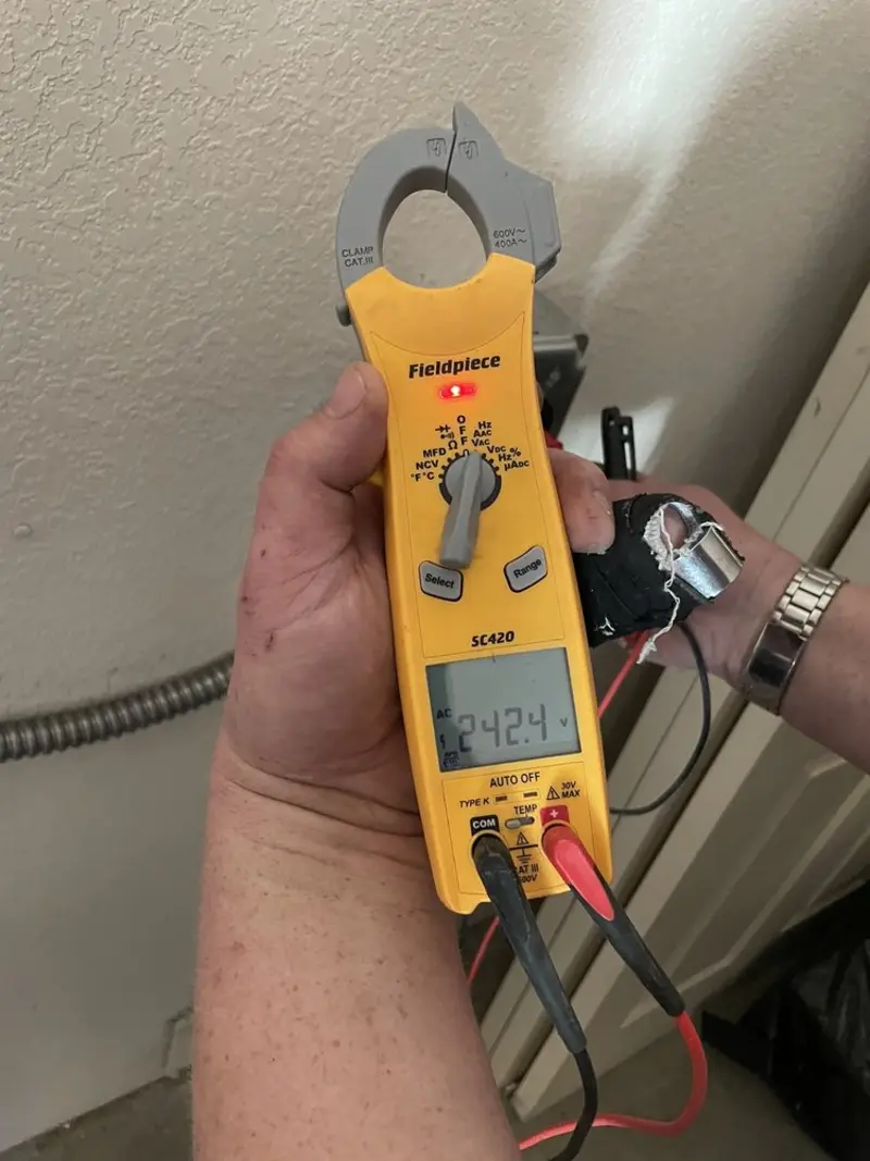 Voltage testing with clamp meter during Outlet Installation in Silver City